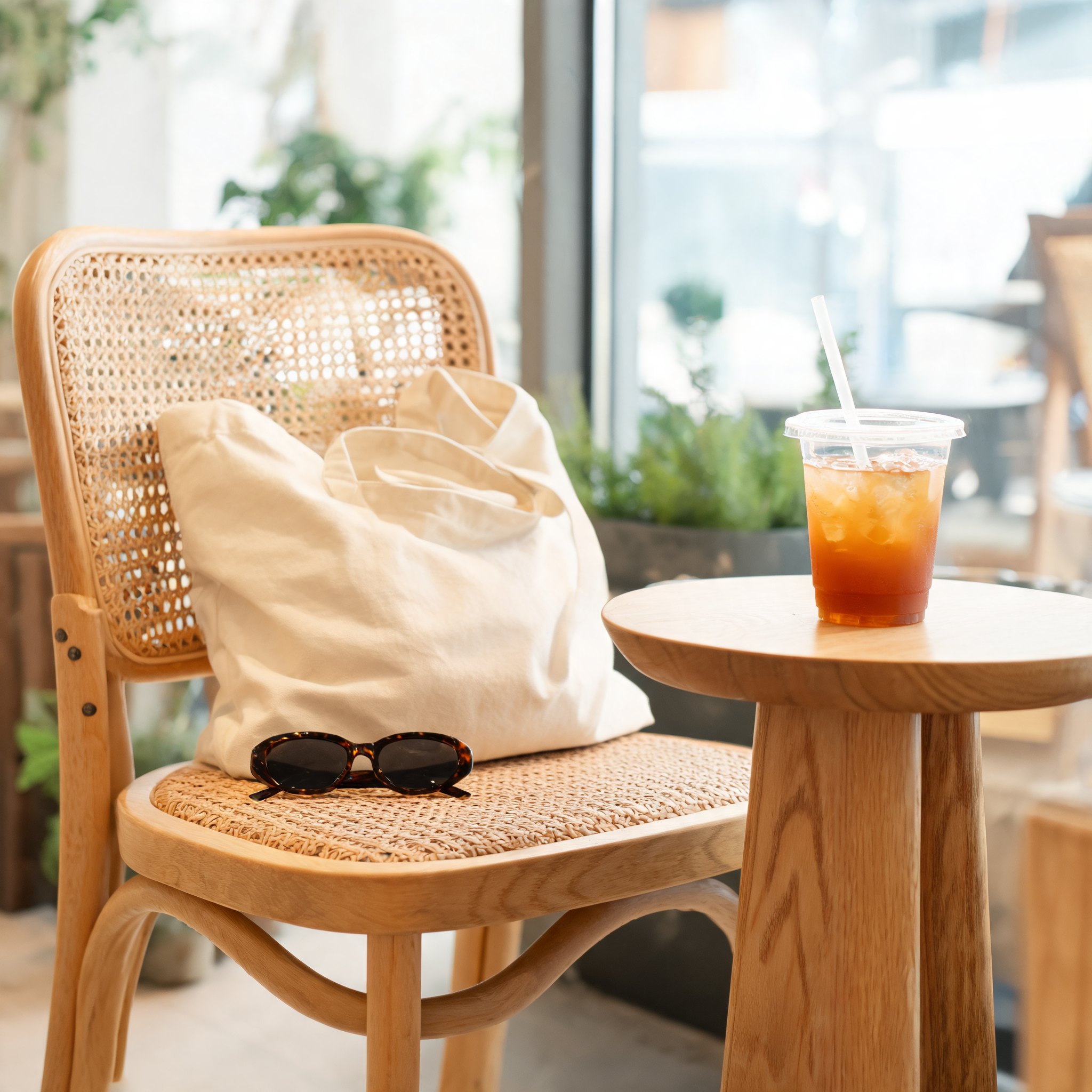 Creator-style product shot of a tote bag in a cafe